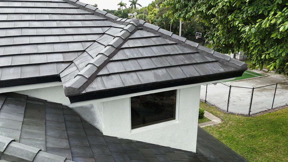 Close-up detail of solar roof tiles at the ridge and hip of a residential property