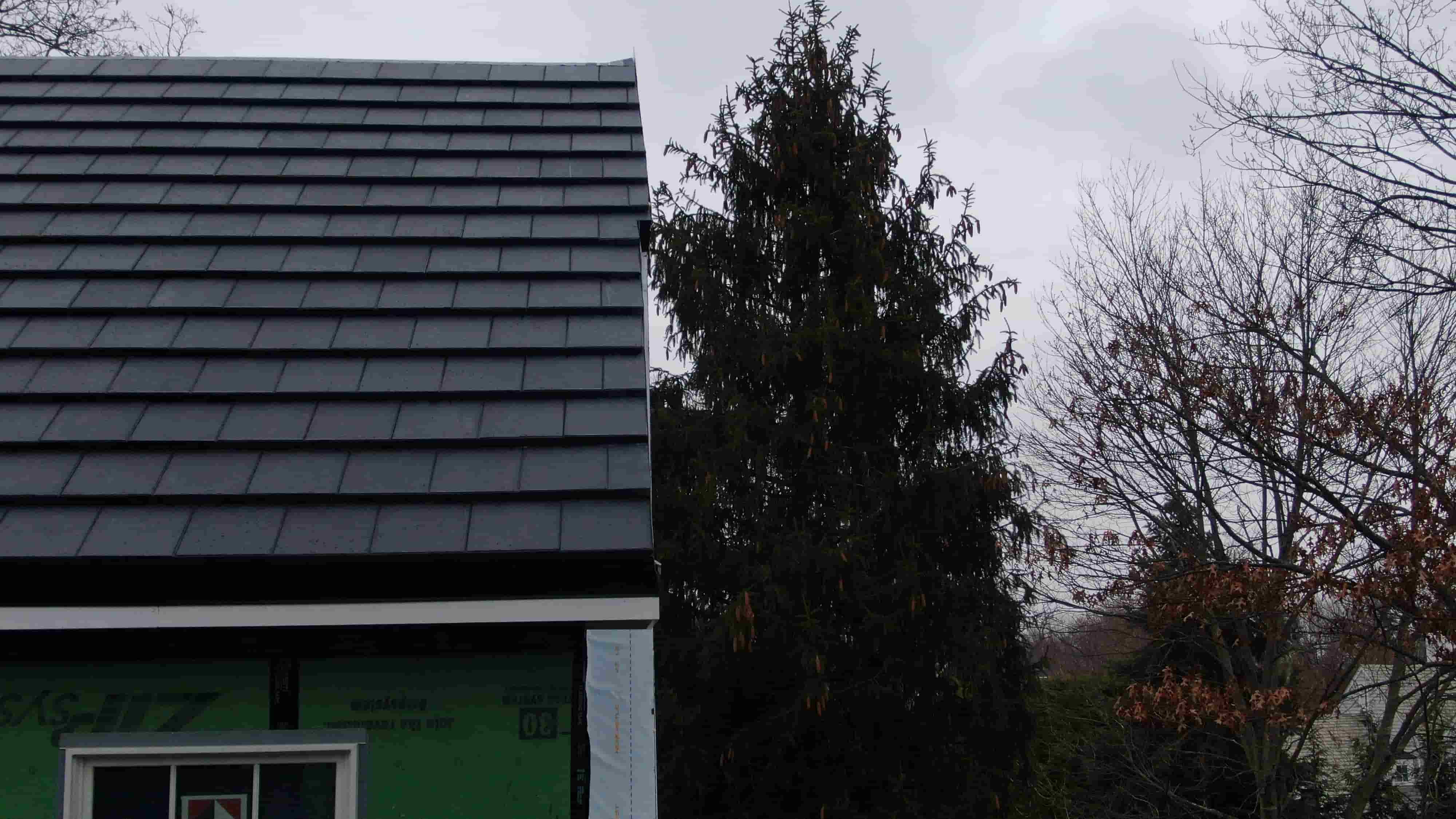 Vitruvion solar roof tile installation aerial view showing invisible energy generation on residential home