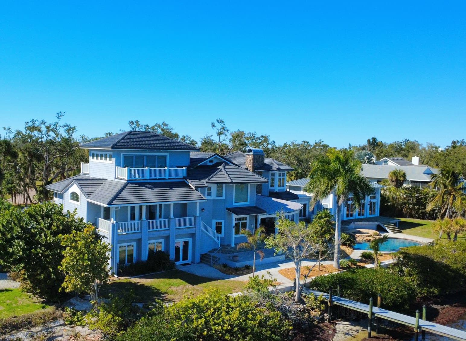 Voltaic integrated concrete solar roof tiles on estate residence showing seamless architectural integration with no visible solar components